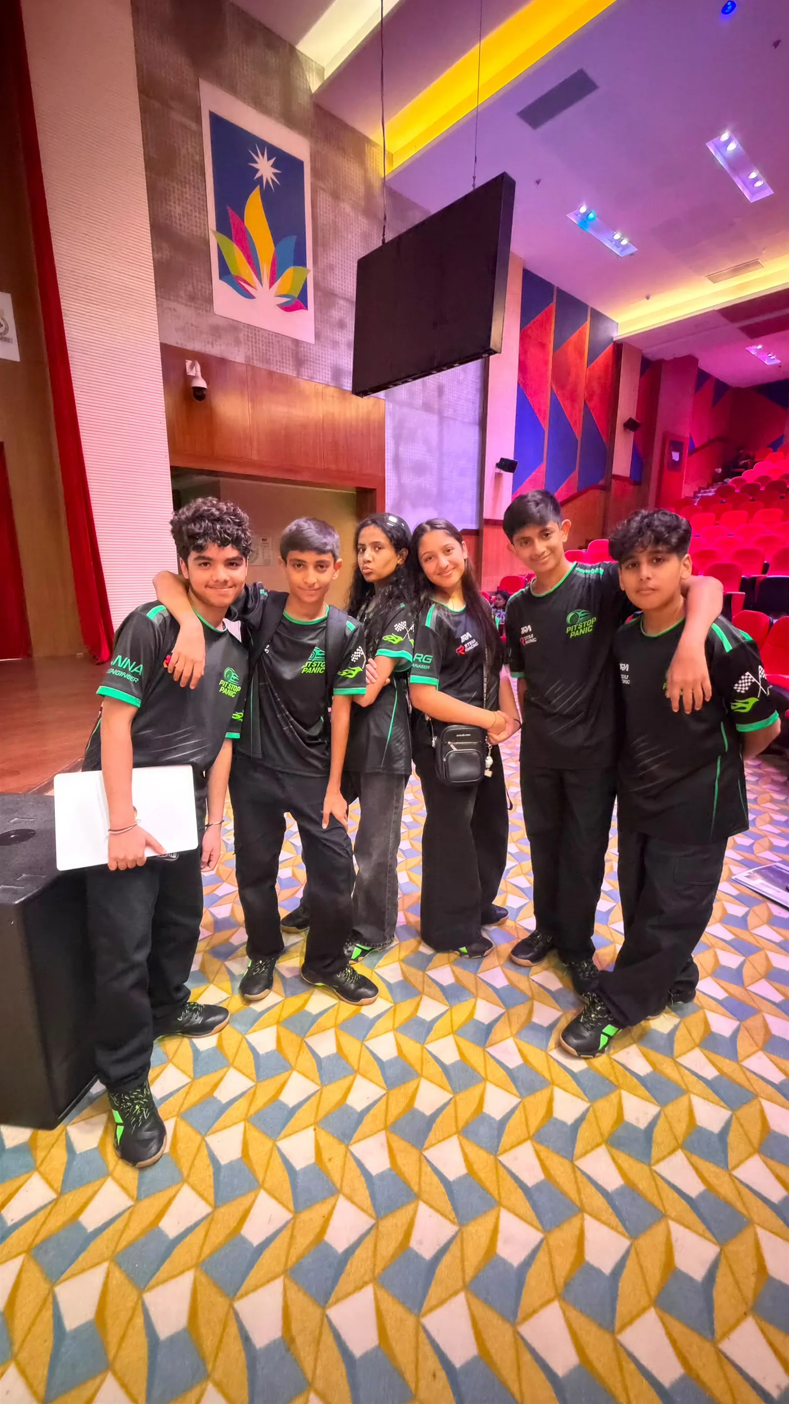 Youth cricket team wearing black and green custom cricket jerseys