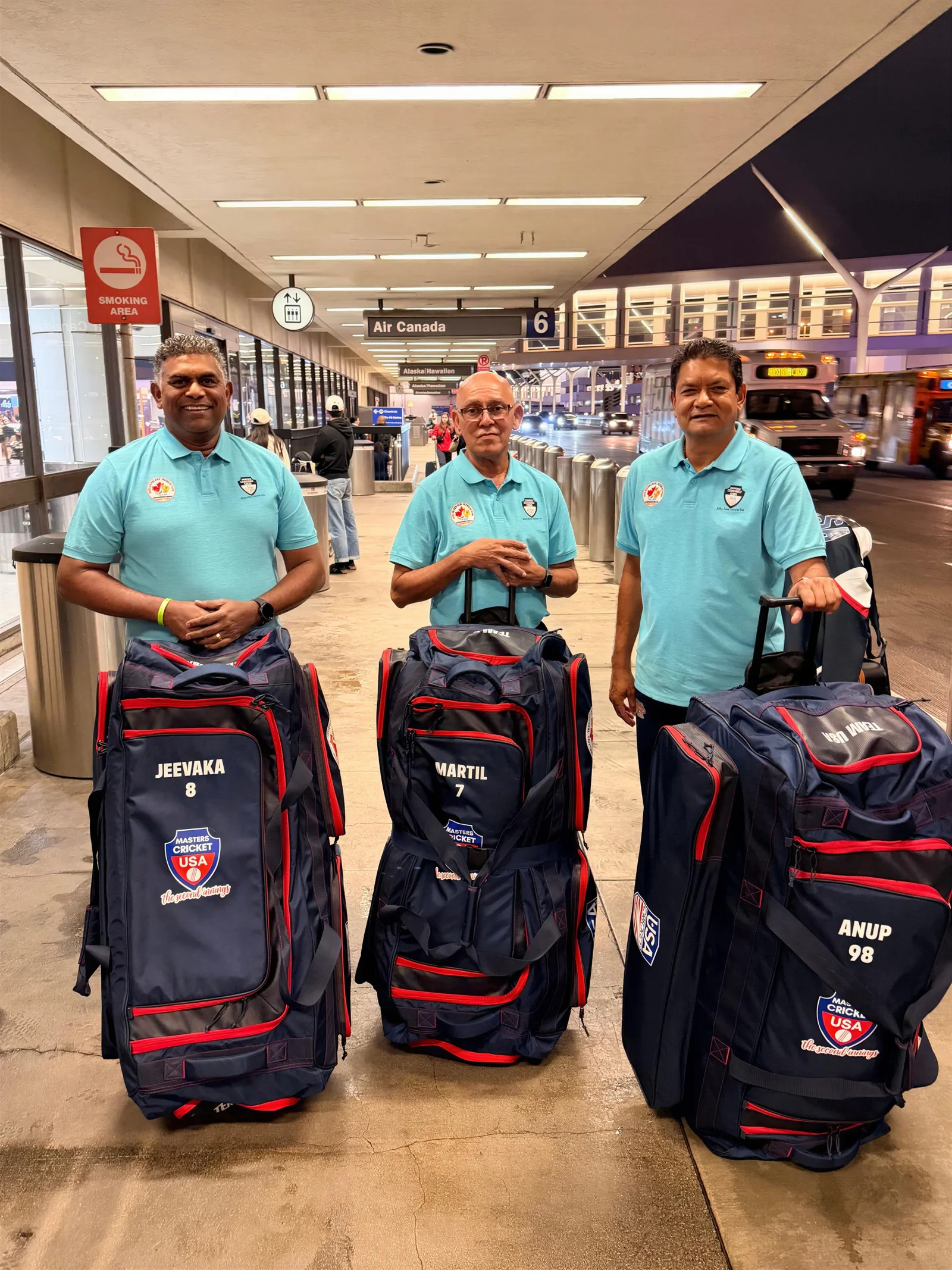 Cricket team travelling with coordinated IRA sportswear and kit bags