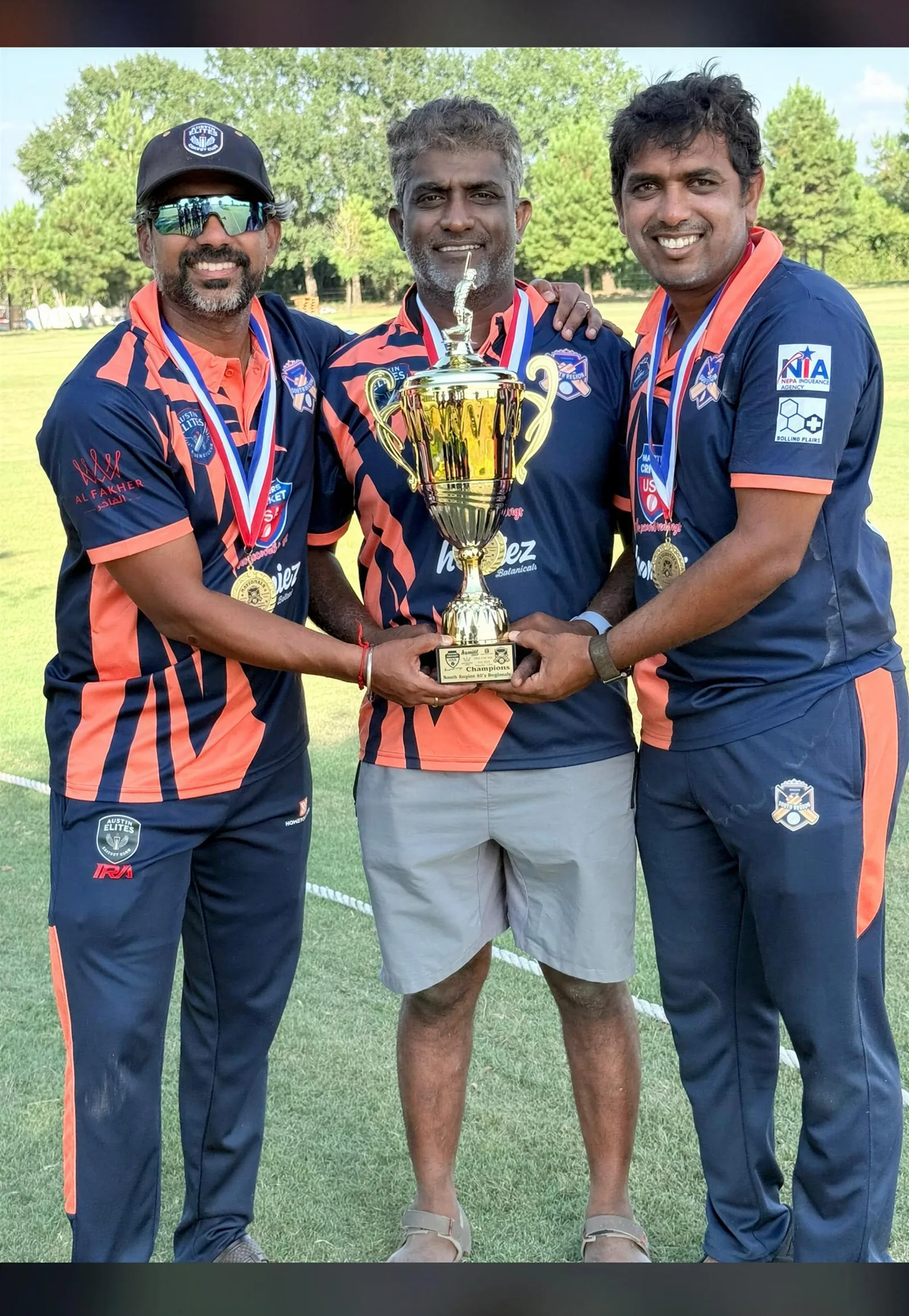 Cricket team celebrating with a trophy in custom cricket jerseys