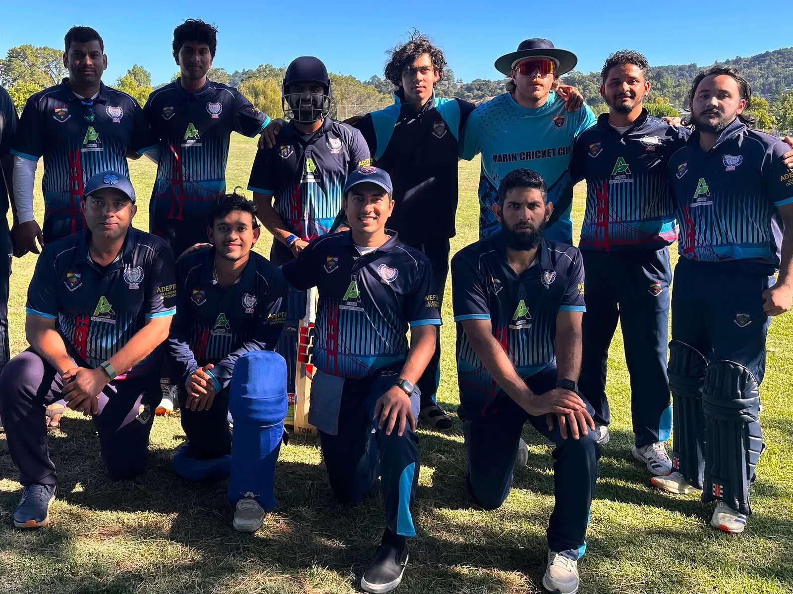 Cricket team group in navy custom cricket jerseys