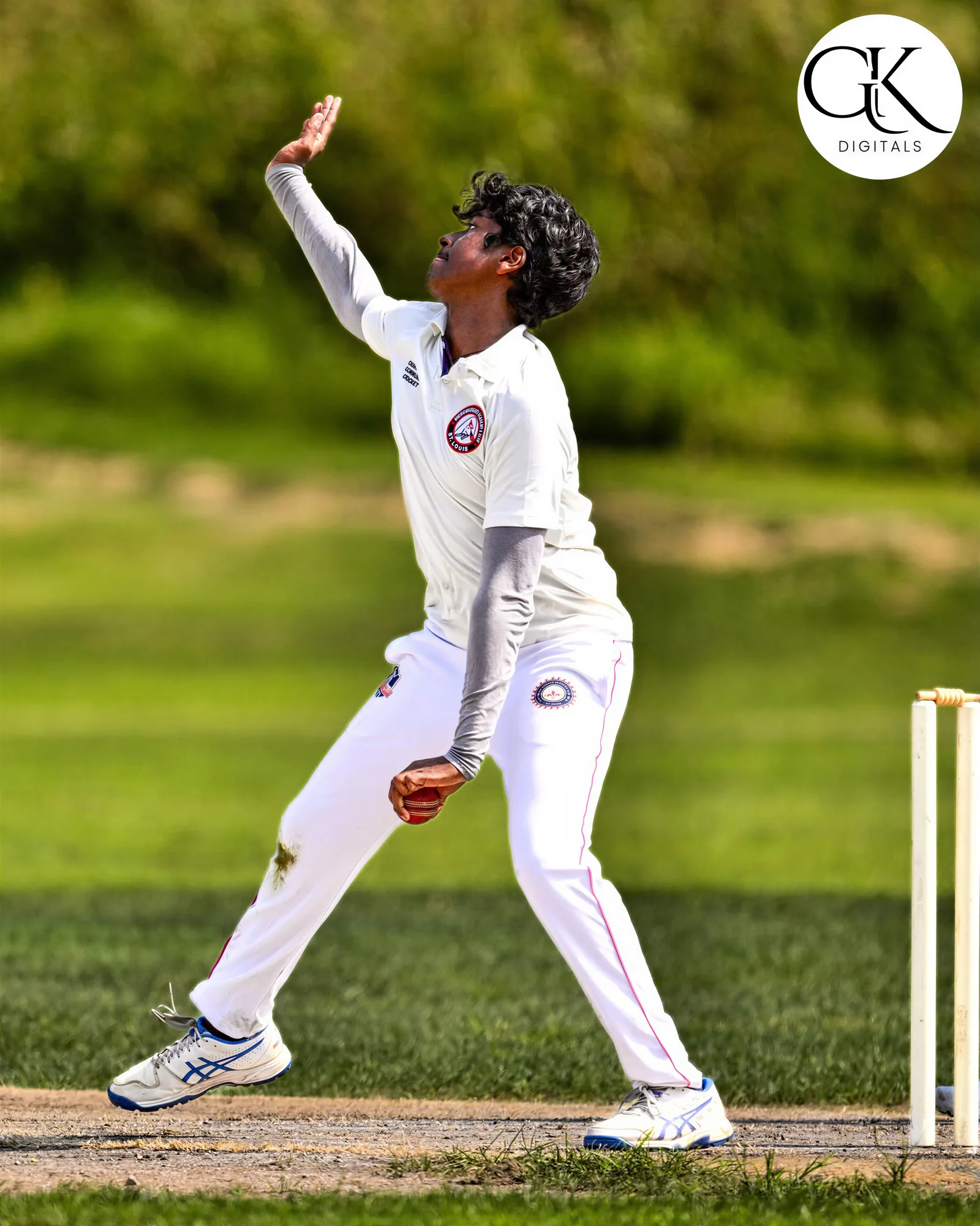 Cricket team wearing coordinated white cricket kits